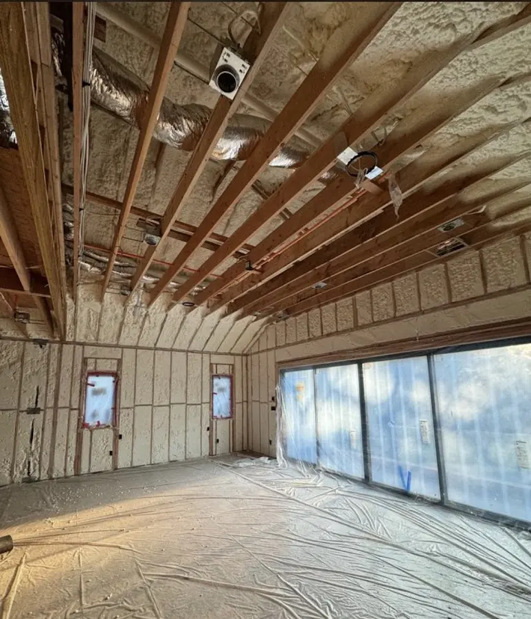 Interior walls and ceiling insulated with spray foam during new construction in Louisville